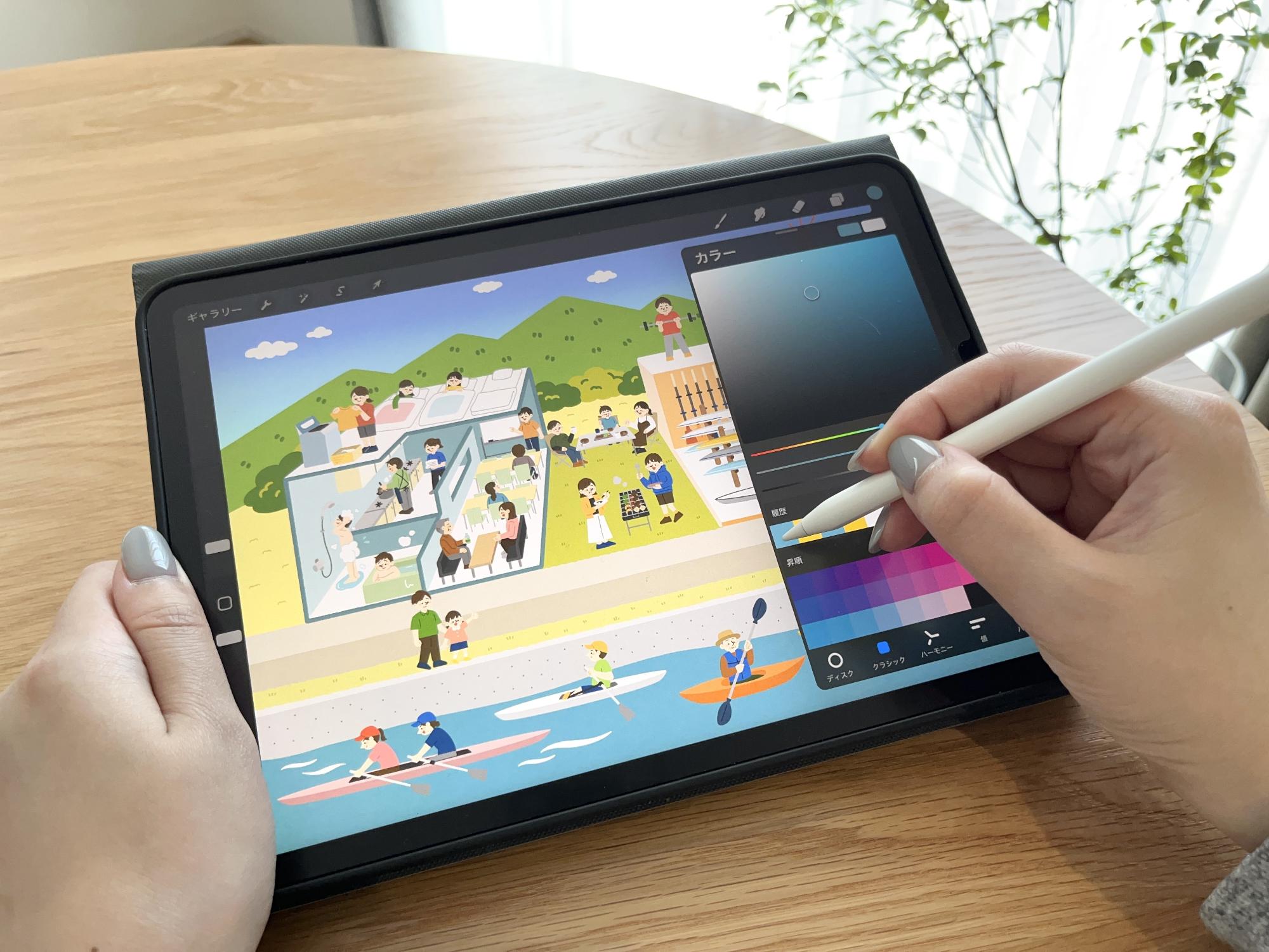 タブレットで漕艇センターのイラストを制作中