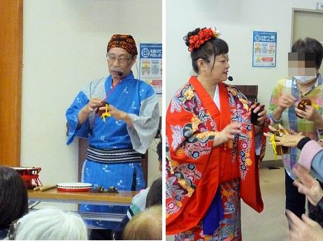 沖縄の楽器を教わる様子